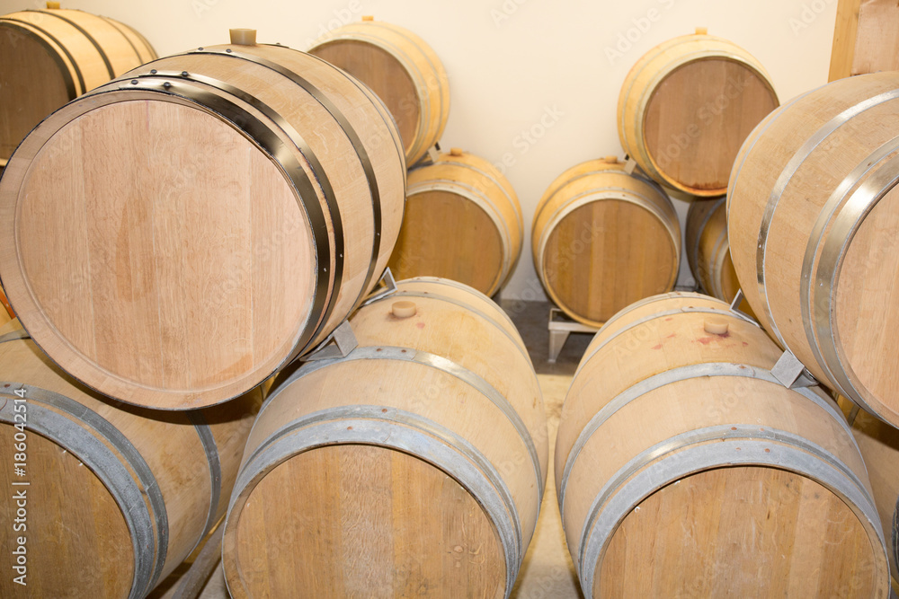 Wine barrels stacked in the cellar