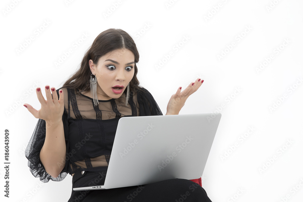 The beautiful lady is using a laptop computer The beautiful lady is using a laptop computer