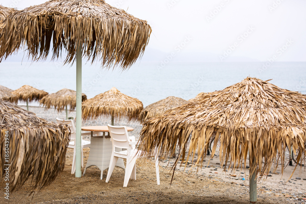 Tropical parasols at Maleme beach on Crete, Greece