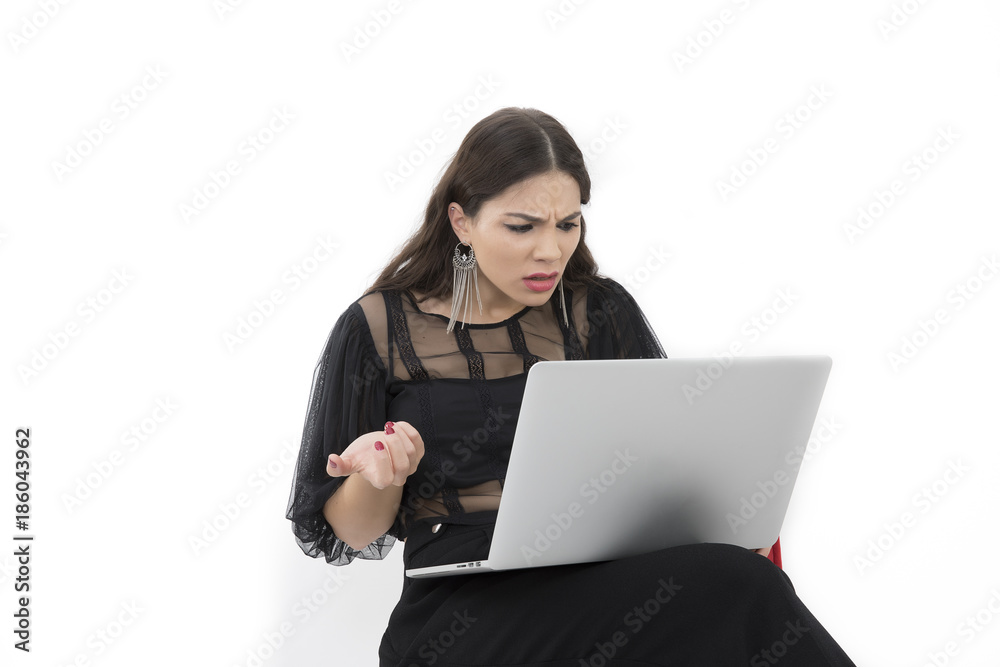 The beautiful lady is using a laptop computer The beautiful lady is using a laptop computer