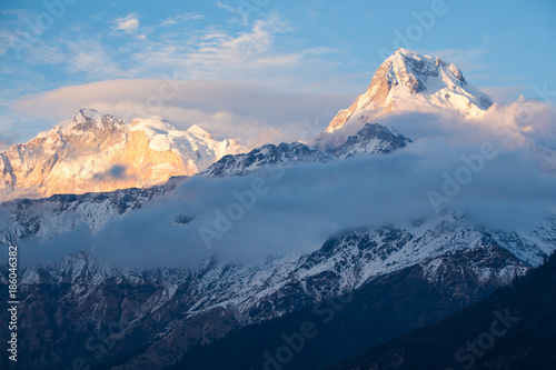 Waves of clouds around the mountains in the Annapurna range in the Himalayas of Nepal