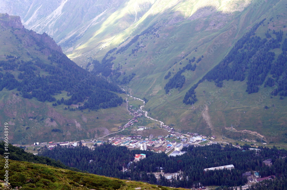 Naklejka premium City in the Caucasus mountains, top view.