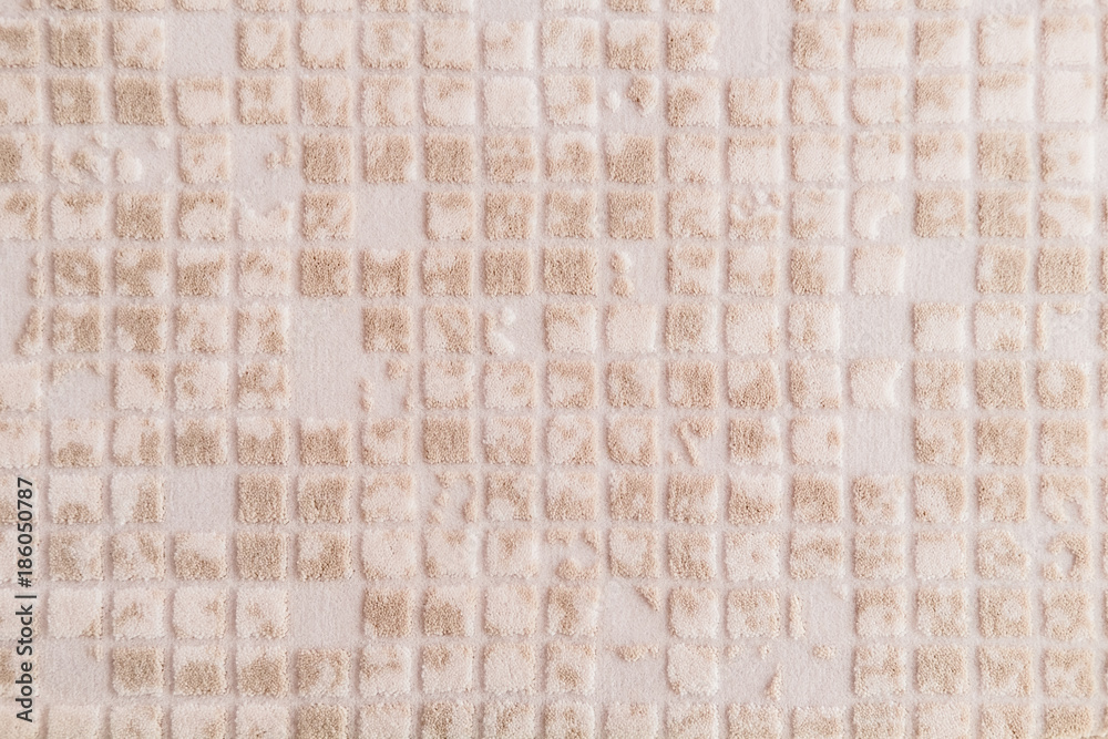 Fototapeta premium Beige soft cozy textured carpet. Close up