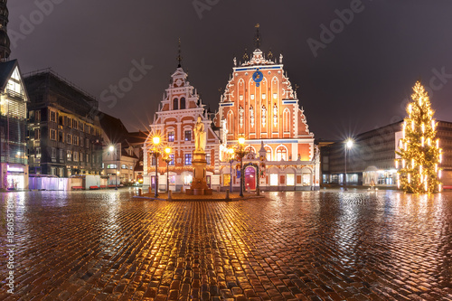 City Hall Square with House of the Blackheads, illuminated Christmas tree and Saint Roland Statue in Old Town of Riga at night, Latvia