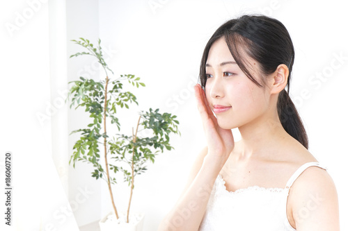 Young woman caring for skin problems