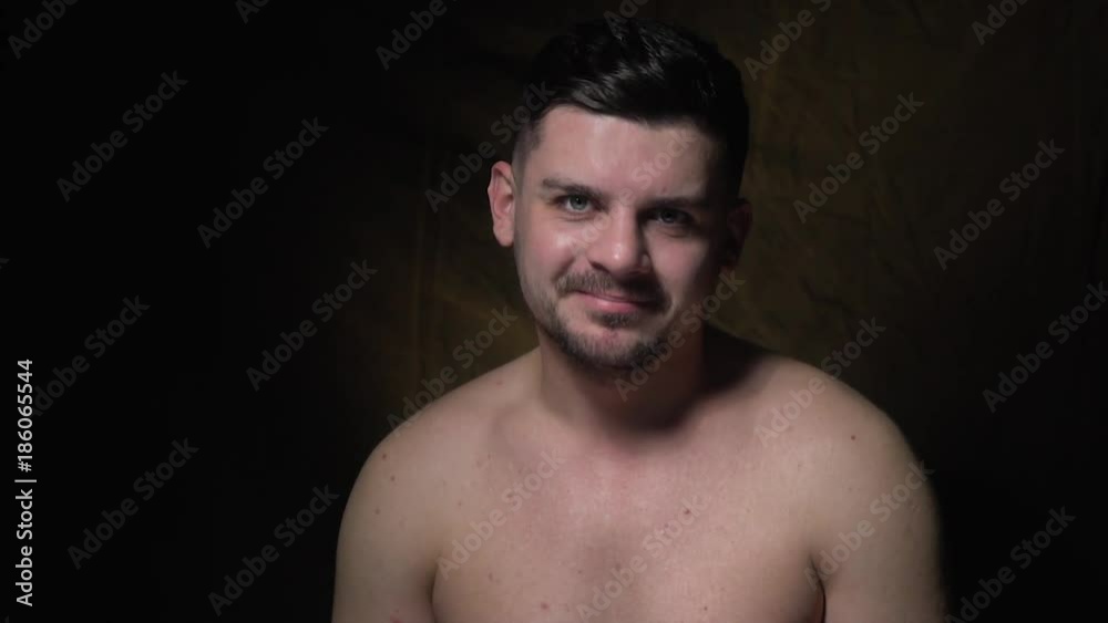 A bearded man with a kind smile calls to himself A bearded man with a kind smile calls to himself