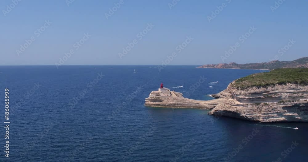 Video shot of open sea on a sunny day near Bonifacio with boats and cliffs in view Video shot of open sea on a sunny day near Bonifacio with boats and cliffs in view
