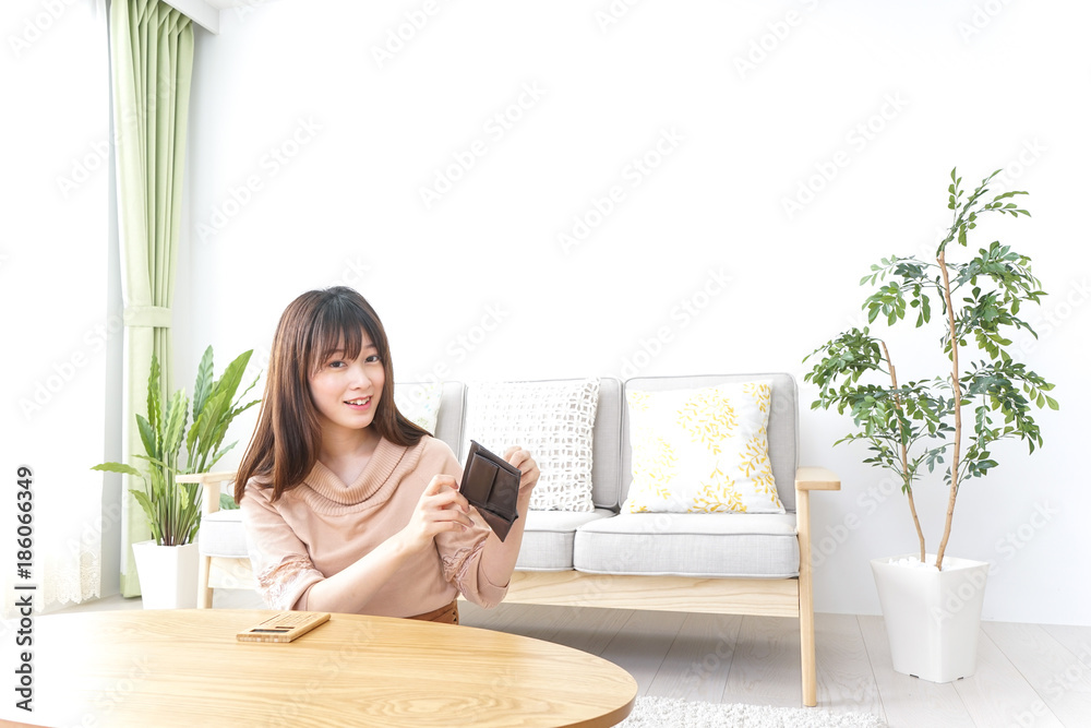 Young woman calculating domestic accounts Young woman calculating domestic accounts