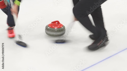 Curling. Stone slides on ice
