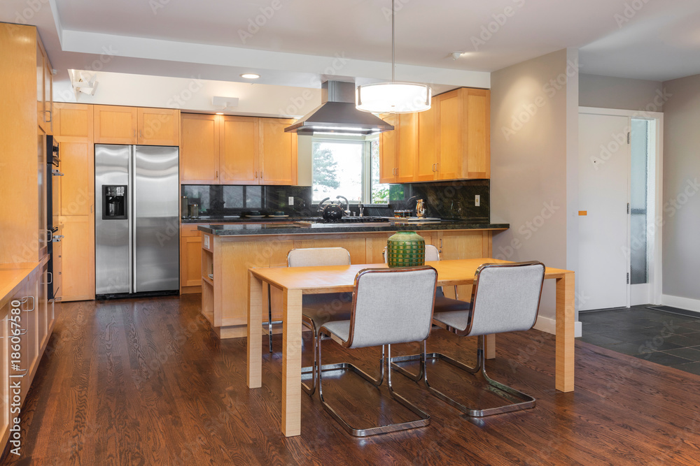 Wooden kitchen with dining table and wooden floor. Wooden kitchen with dining table and wooden floor.