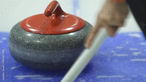 Curling. Stone slides on ice