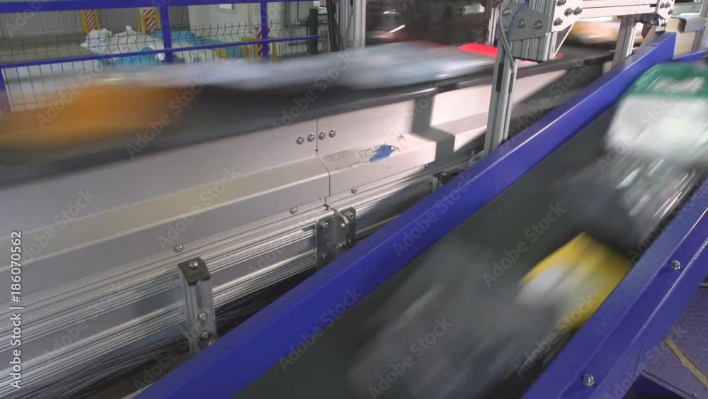 Logistics mail center, parcels traveling on conveyor belt