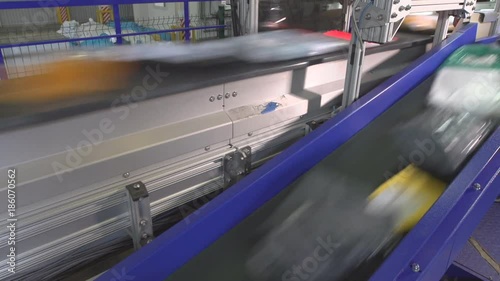 Logistics mail center, parcels traveling on conveyor belt
