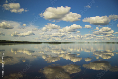 Fototapeta Naklejka Na Ścianę i Meble -  Clouds over the lake on a summer day.