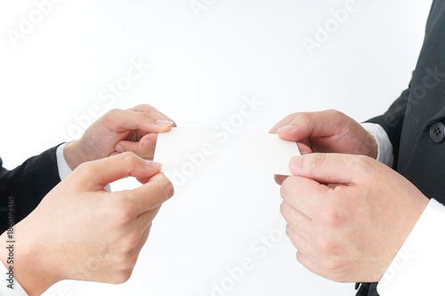 Business persons exchanging  business cards