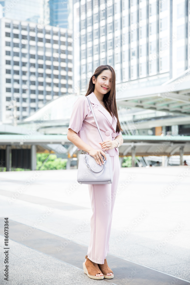 Young Asian lady working outdoors Young Asian lady working outdoors
