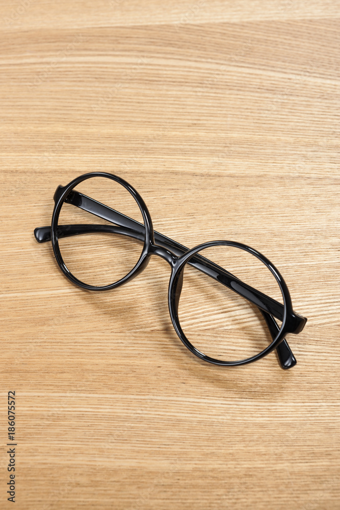 wood table with black glasses isolated on the white background wood table with black glasses isolated on the white background