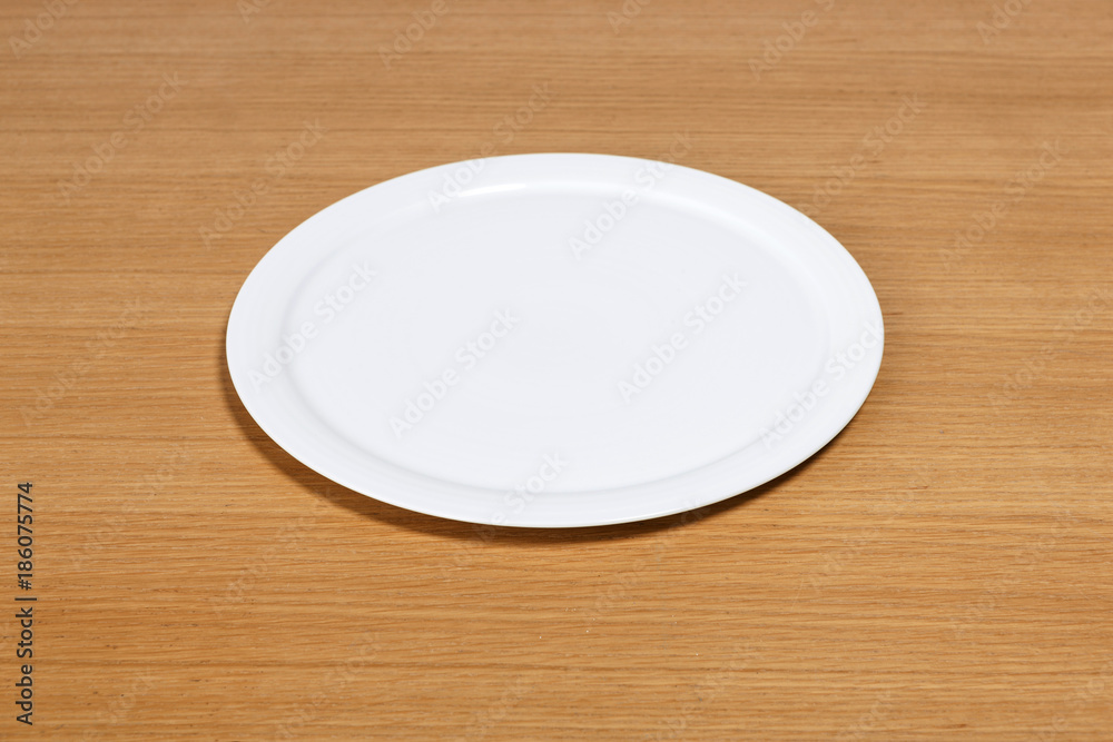 wood table with empty dish isolated on the white background wood table with empty dish isolated on the white background