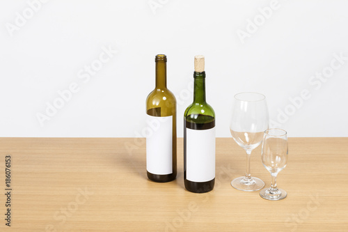 wine bottle and glasses on the wood table isolated on the white background