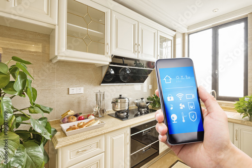 smart phone with smart home and modern kitchen