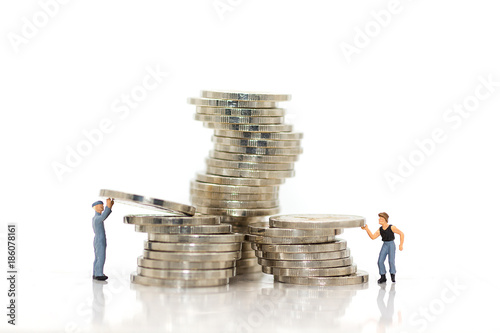 Miniature people : Workers work hard to keep money for everyday use.