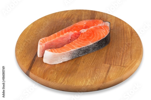 Fresh salmon fish on wooden cooking desk