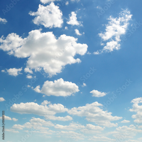 Light cumulus clouds against the blue sky.