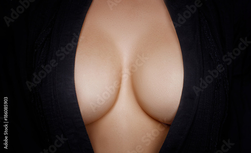 Topless beauty woman body covering her big breast