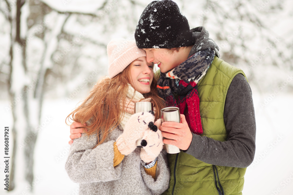 Cheerful date. A couple has fun and laugh while drinking something hot and tasty. Cheerful date. A couple has fun and laugh while drinking something hot and tasty.