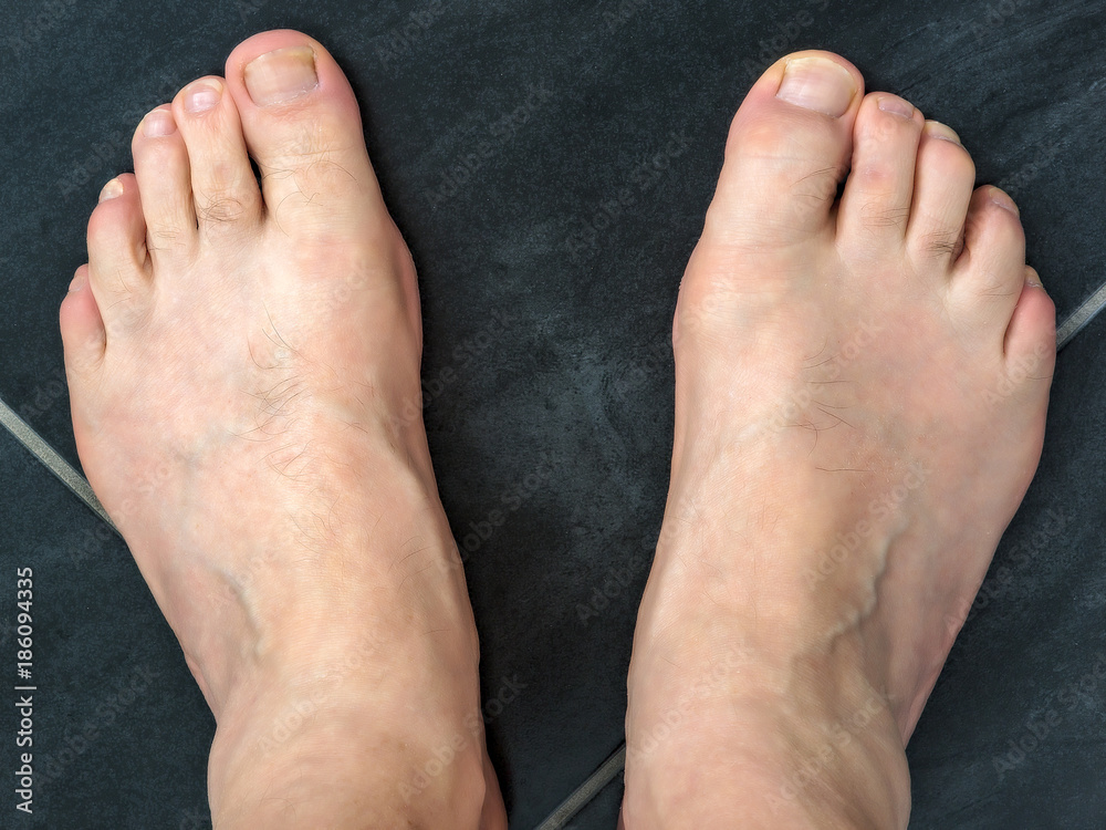 Fototapeta premium Naked feet of a man 60+