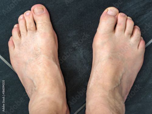 Naked feet of a man 60+