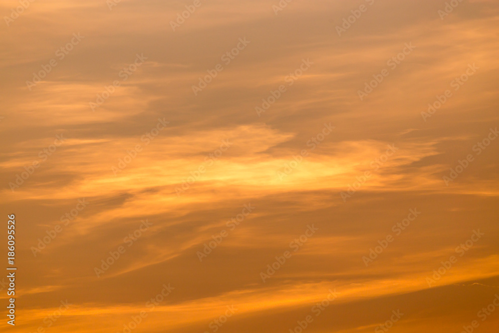 Obraz premium clouds in the sky at sunset as background