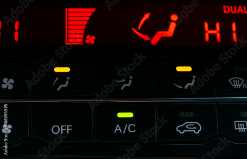 Air conditioning button inside a car. Climate control AC unit in the new car. Modern car interior details