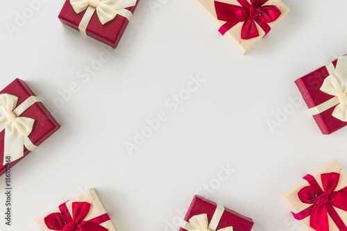 Creative layout made of colorful gift boxes. Flat lay. Minimal holiday concept.