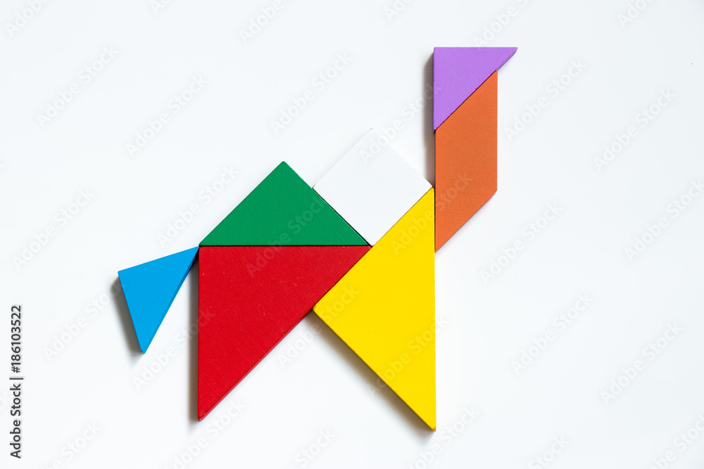 Colorful wood tangram puzzle in camel shape on white background Colorful wood tangram puzzle in camel shape on white background