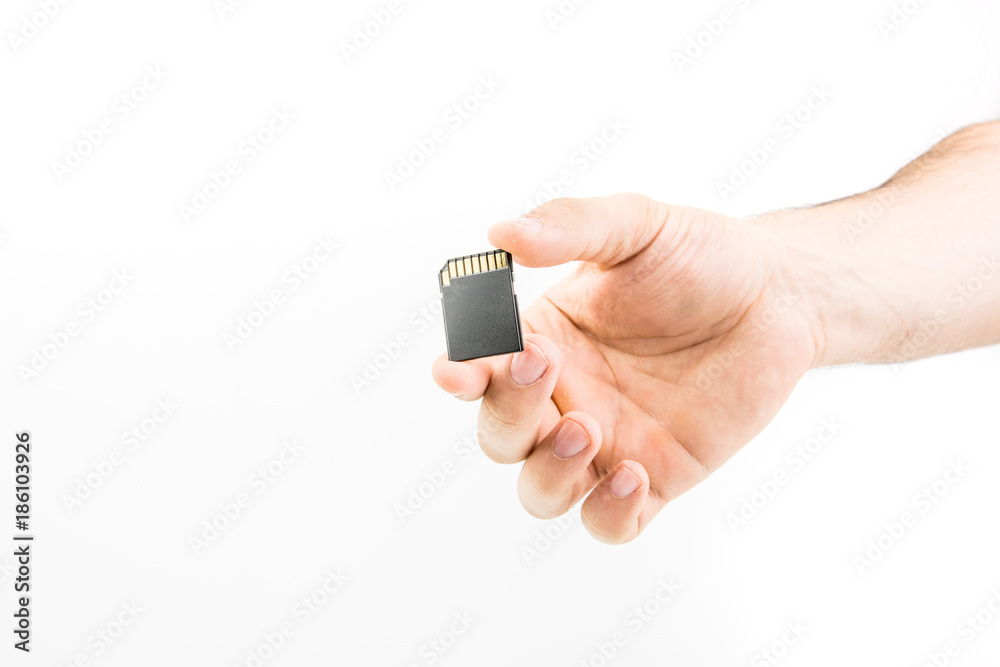 Hand Holding Memory Card On White Background Hand Holding Memory Card On White Background