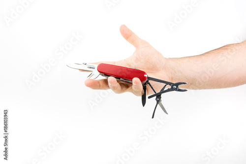 Hand Holding Multi-functional Red Knife On White Background