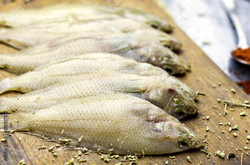 not baked fresh sole fish on wood cutting board