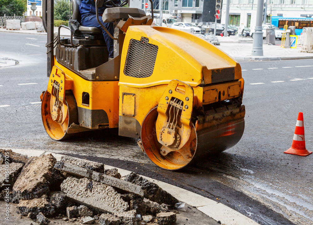 Asphalt compactor in the city