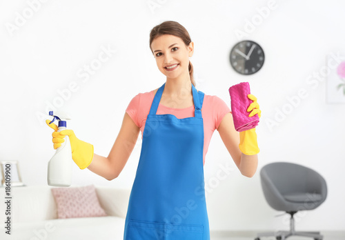 Young woman with bottle of ...