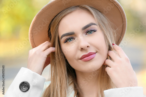 Beautiful young woman in park