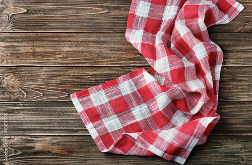 Checkered kitchen towel on wooden table