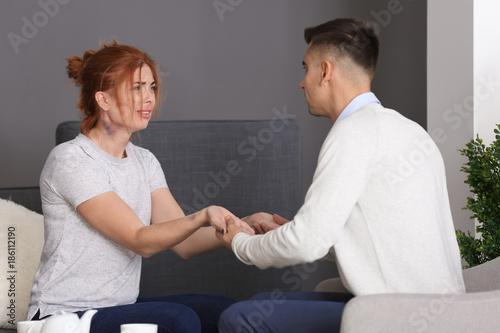 Male psychologist with clie...