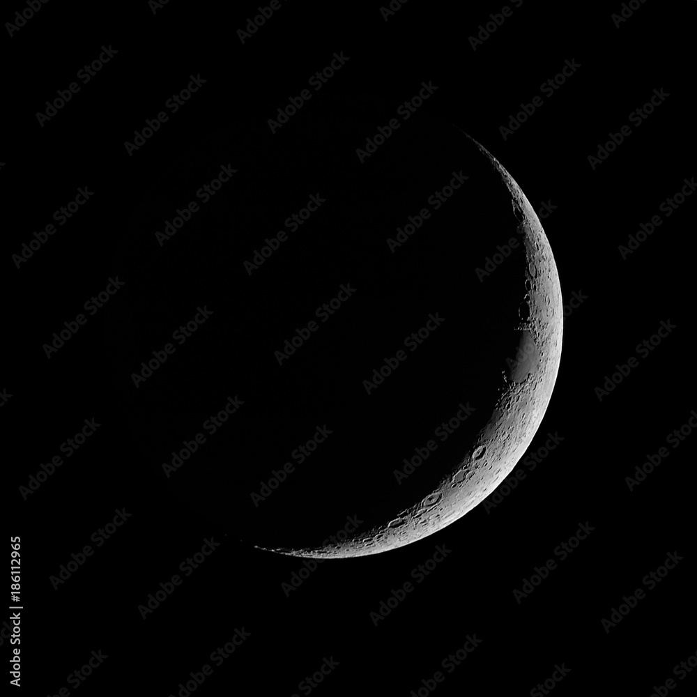 Fototapeta premium Moon - Waxing Crescent against black sky background