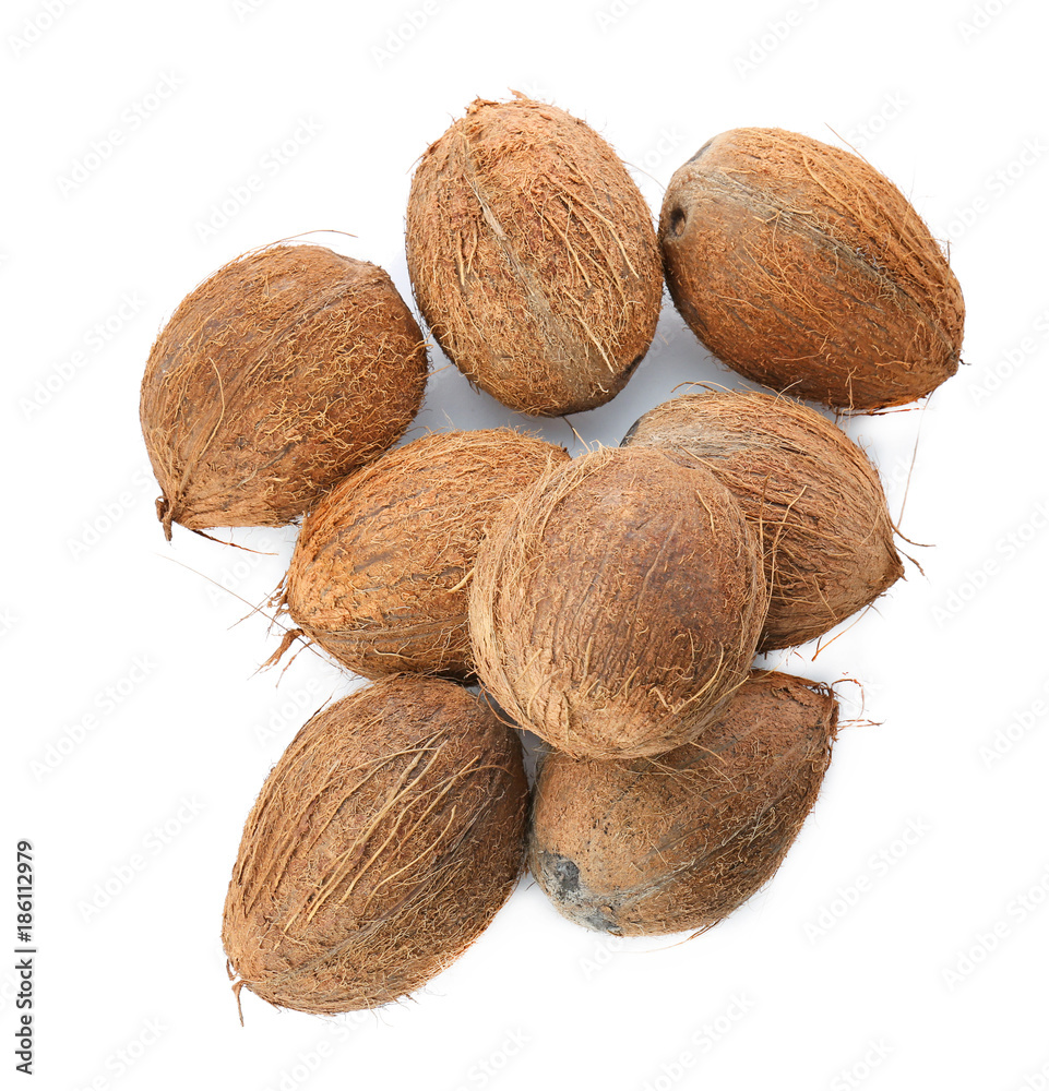 Many ripe coconuts on white background Many ripe coconuts on white background