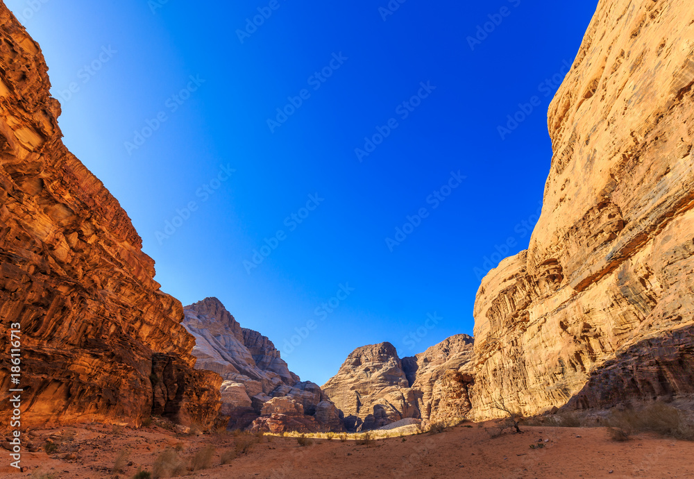 Scenic view of the yellow colored mountain rocks in the Wadi rum desert in Jordan at early-morning