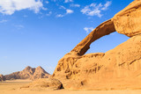 Scenic view of the yellow colored arch rock in the Wadi rum desert in Jordan