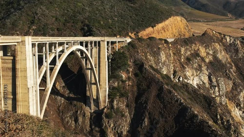 a close up panning view of bixby bridge on highway 1 along the california coast in big sur