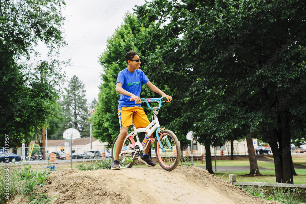 Teen boy riding dirt bike on track course Stock-foto | Adobe Stock