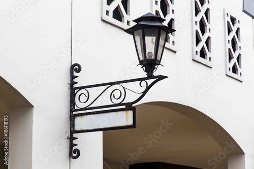 Old lamp and street sign photo